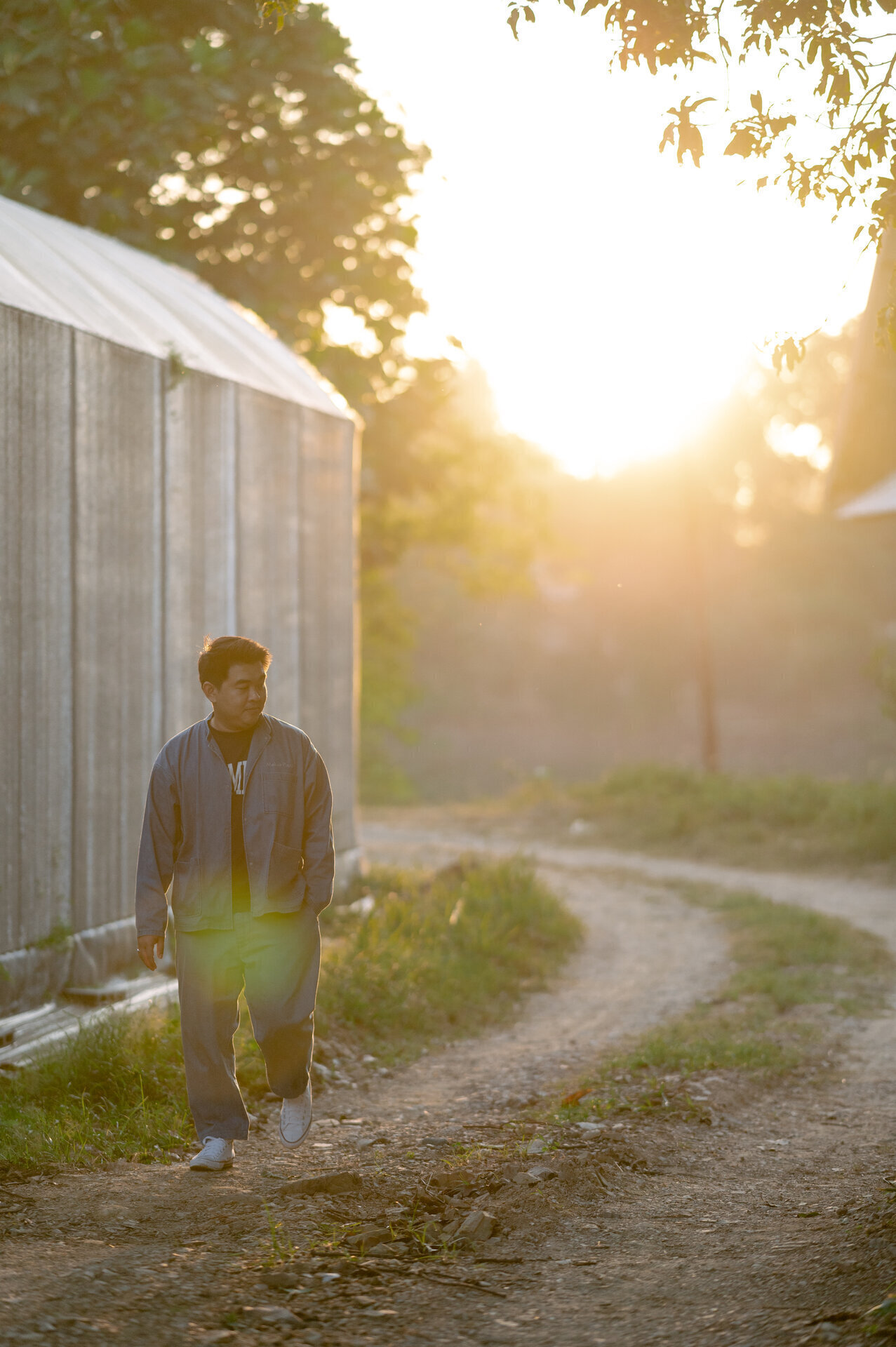 Vast empty field with rolling hills at sunset